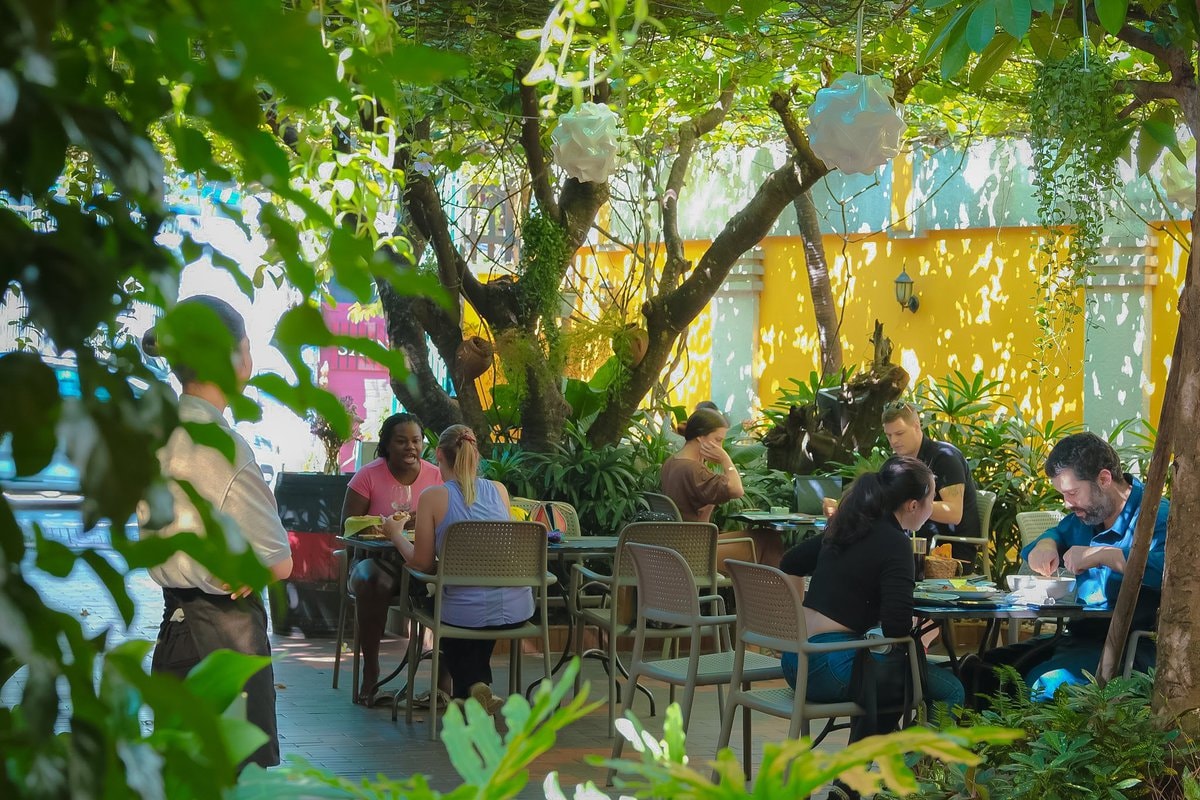 The restaurant exudes a romantic vibe, featuring a breezy garden